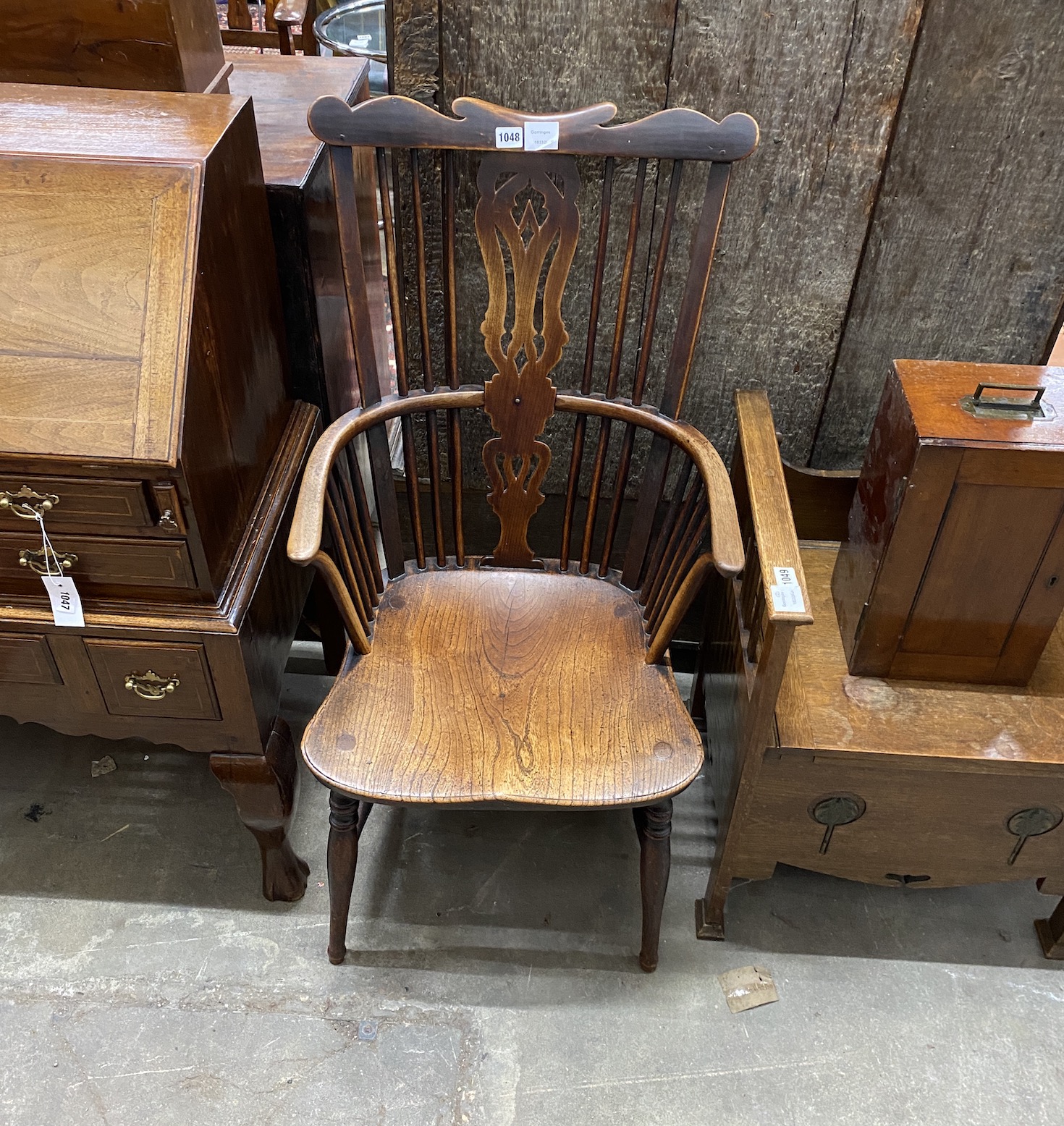 A 19th century Windsor elm and fruit wood comb back armchair with pierced central splat, width 51cm, depth 43cm, height 104cm